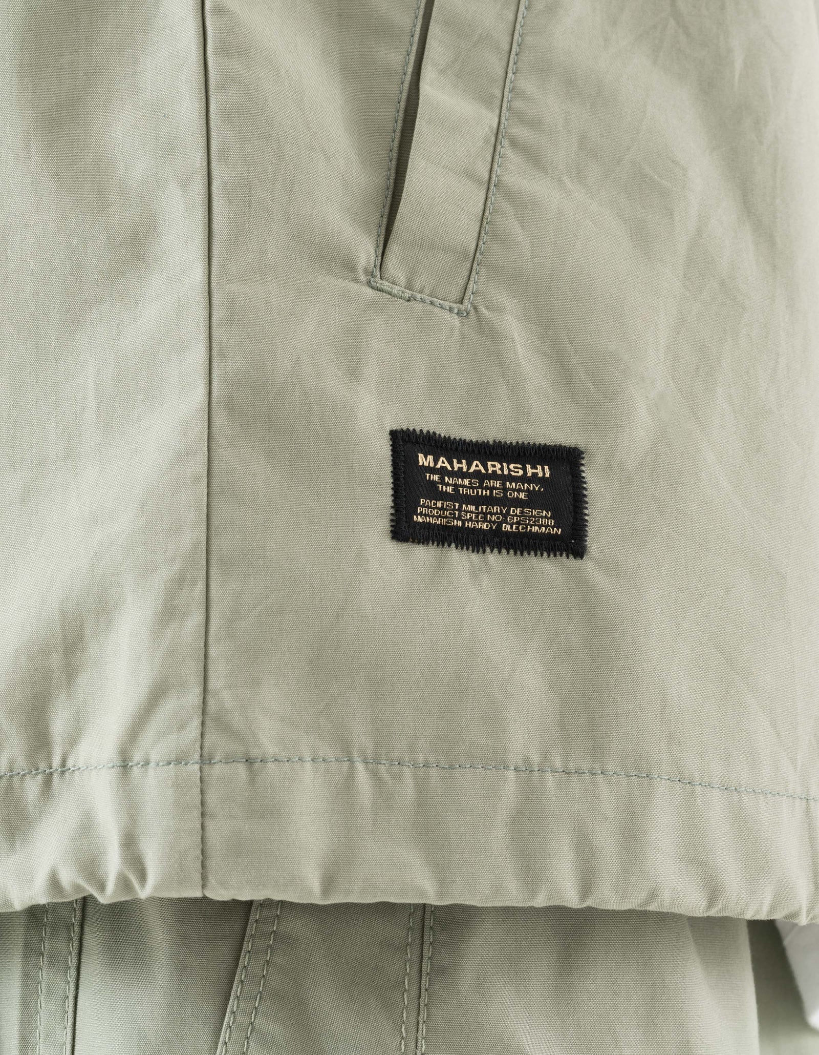 7211 Asym Woven Track Top Sage